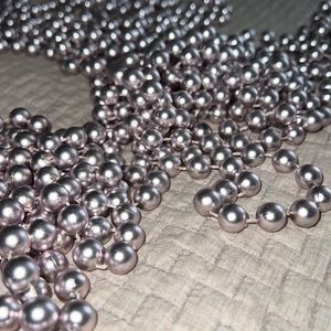 Set of 4 shiny pale metallic pink beaded garland.